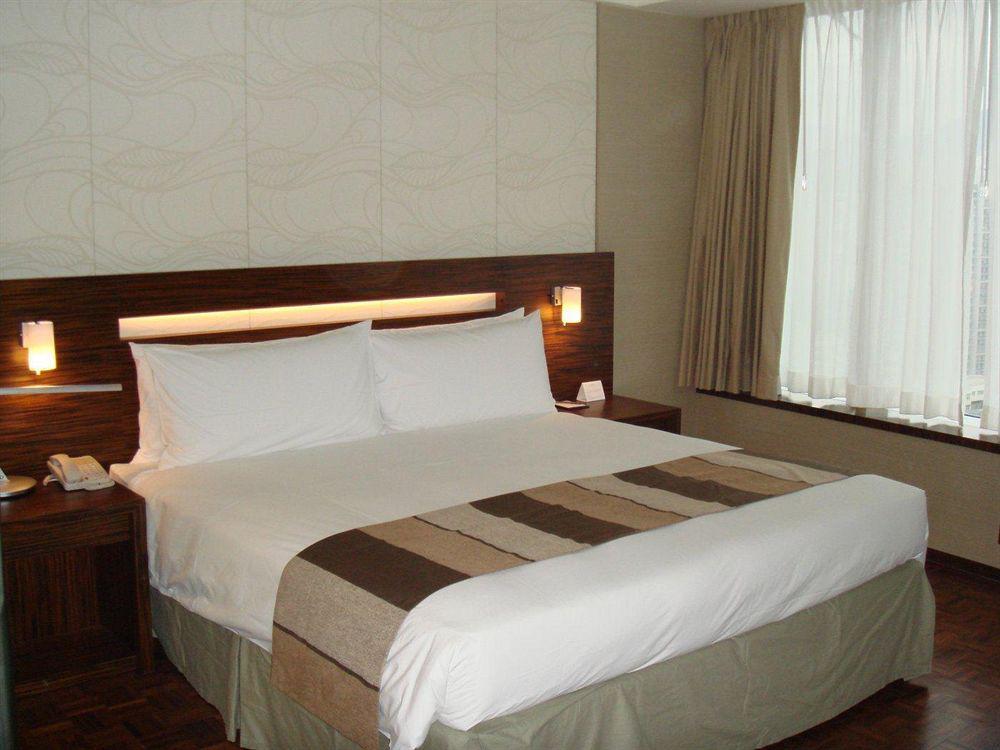 Nina Hotel Tsuen Wan West Hong Kong Exterior foto A bed